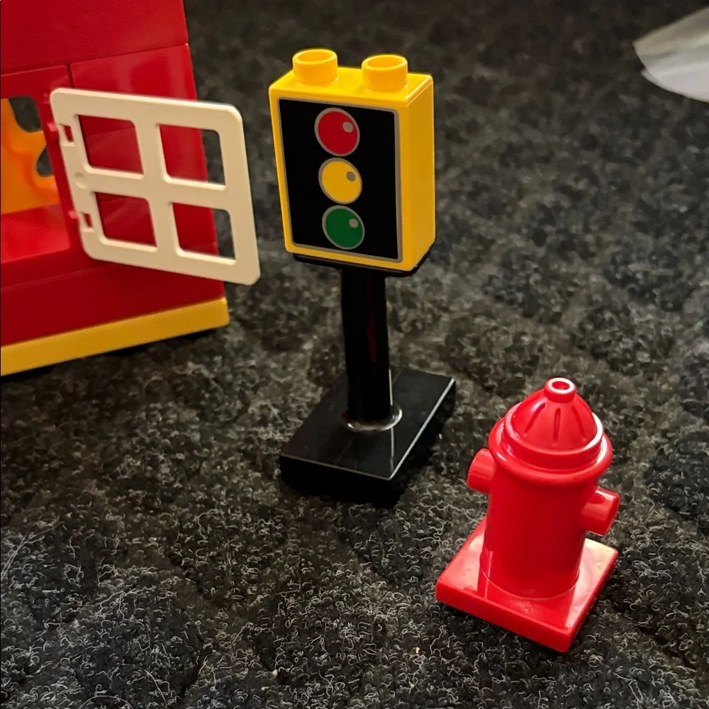 Lego Duplo Fire Truck With Firefighter Figure with fire hydrant and flame pieces